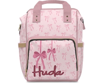 Mochila pañalera personalizada con lazo rosa: mochila de viaje personalizada