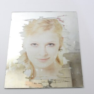 Mirror with personalized motif