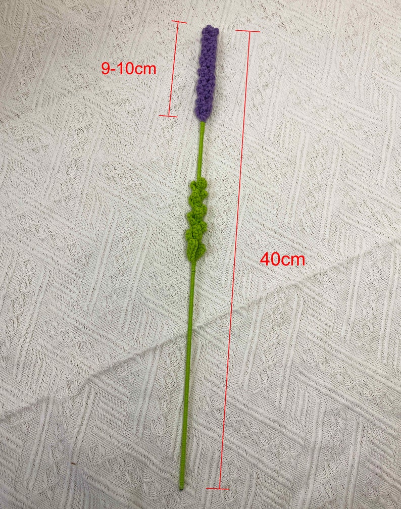 May include: A purple and green artificial lavender flower stem, approximately 9-10 inches tall and 40 inches long.