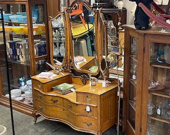 Vintage Tiger Oak Serpentine vanity dresser with curved drawers and hinged beveled glass mirrors