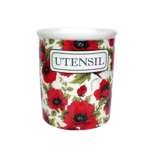 May include: White ceramic utensil holder with a red poppy floral pattern and the word "UTENSIL" printed on the front.