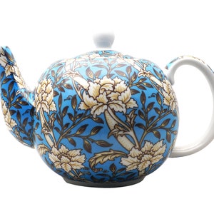 May include: A blue and white teapot with a floral pattern. The teapot has a white lid and a white handle.