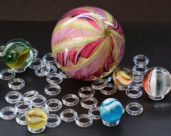 Fifty Acrylic Marble Stands For Marble Display. Minimalist Clean Design. Supports a wide range of sizes.