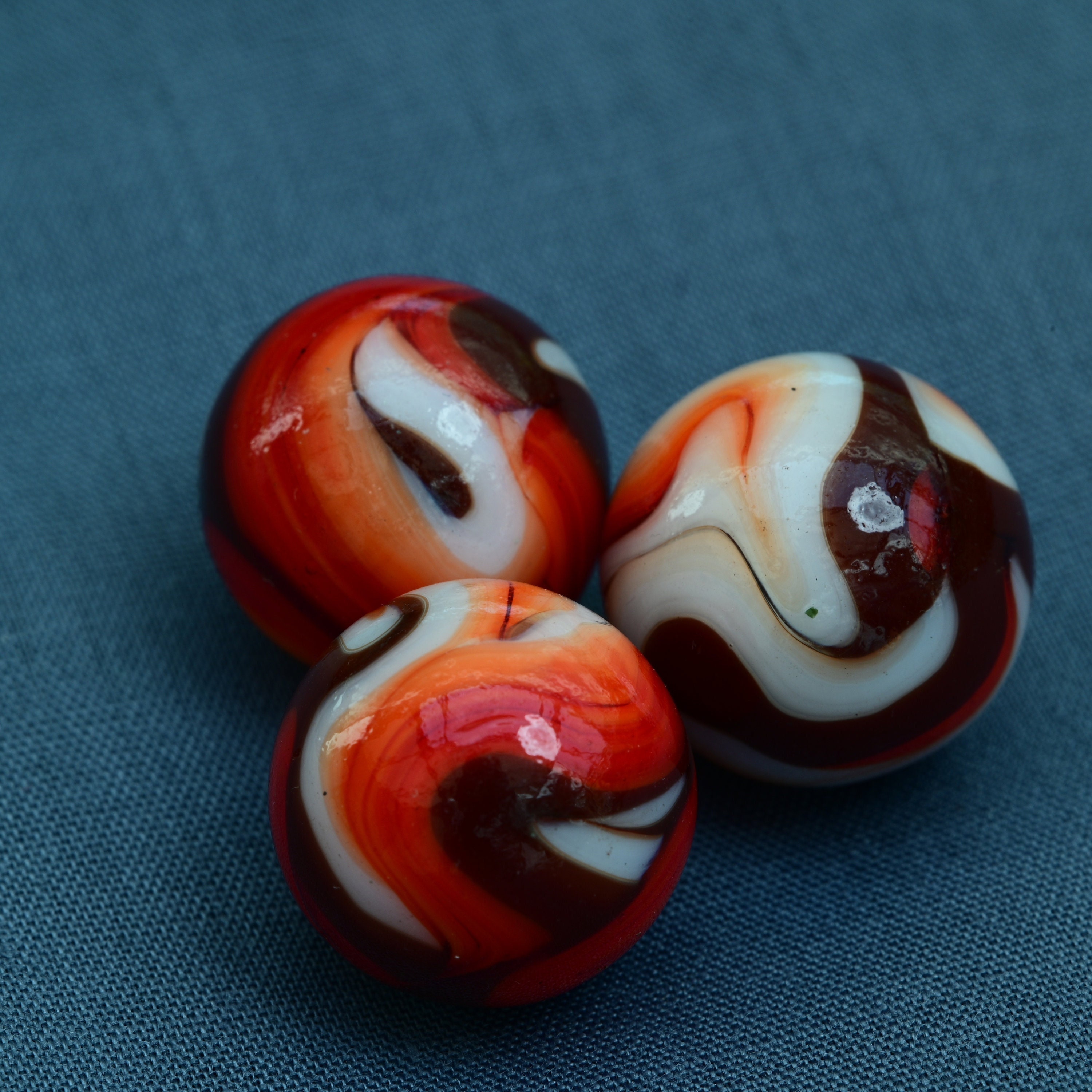 Round we go by Sarah Lust on   Glass marbles, Red glass, Black and  gold marble