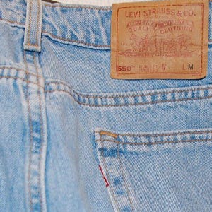 Vintage 1997 Levi’s 550 Jeans – Light Wash Blue – USA Made – 41W 31L – Relaxed Fit Denim