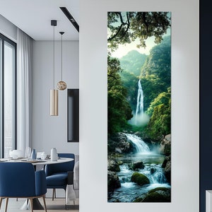 May include: Vertical canvas art print featuring a vibrant waterfall scene. The artwork showcases a cascading waterfall surrounded by lush green trees and rocks. The image captures the beauty of nature, with a focus on the water's movement and the surrounding foliage.