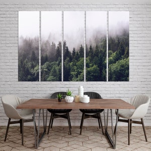May include: A panoramic view of a misty forest with lush green trees. The fog creates a dreamy and ethereal atmosphere, highlighting the natural beauty of the woodland.