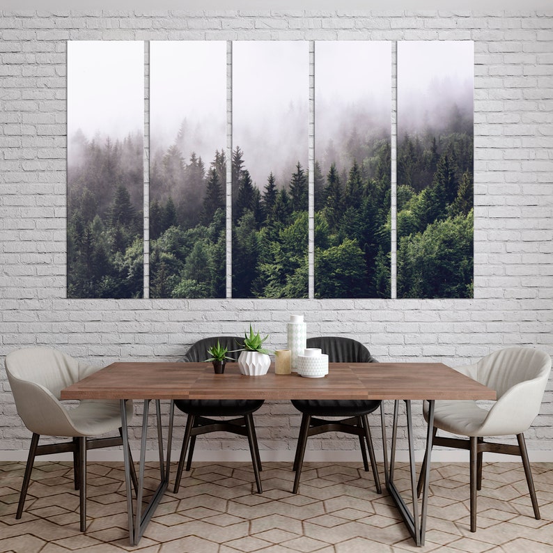 May include: A panoramic view of a misty forest with lush green trees. The fog creates a dreamy and ethereal atmosphere, highlighting the natural beauty of the woodland.