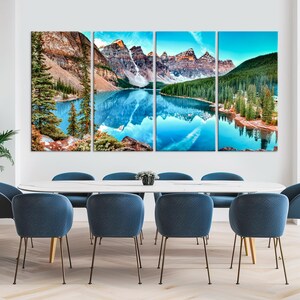 May include: A four-panel canvas print showing a scenic mountain lake with a reflection of the surrounding mountains in the water. The lake is surrounded by lush green trees and the mountains are a mix of brown and green.