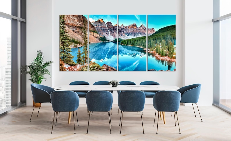 May include: A four-panel canvas print showing a scenic mountain lake with a reflection of the surrounding mountains in the water. The lake is surrounded by lush green trees and the mountains are a mix of brown and green.