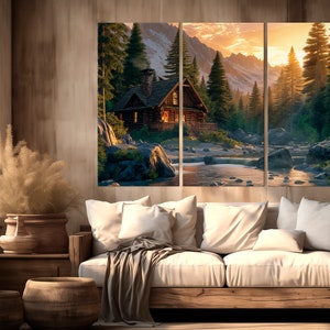 May include: A three-panel canvas print showing a rustic cabin situated in a verdant forest. The cabin has a wooden exterior and a stone chimney. A river flows in front of the cabin, with mountains visible in the background. The sky is a vibrant orange and yellow, suggesting a sunset.