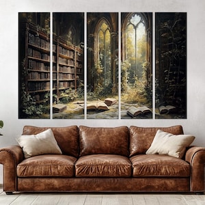 May include: A five-panel wall art set depicting a dark, overgrown library interior with tall arched windows, stone floors, and open books scattered on the ground, positioned above a brown leather sofa with two cream-coloured throw pillows.