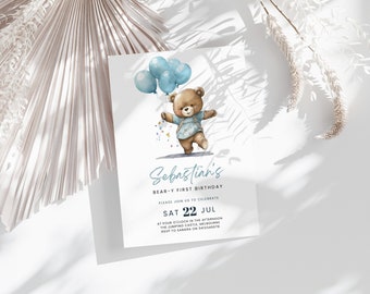 May include: A blue and white birthday invitation with a cartoon illustration of a brown bear holding blue balloons. The text reads "Sebastian's Bear-y First Birthday. Please join us to celebrate Sat 22 Jul at four o'clock in the afternoon. The Jumping Castle, Melbourne. RSVP to Sandra on 0412345678"