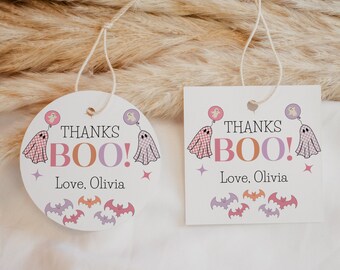May include: Two white thank you tags with a ghost and bat theme. The text on the tags reads "Thanks Boo! Love, Olivia".
