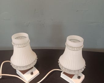 Great pair of mid century bedside lamps with a glass shade and metal base