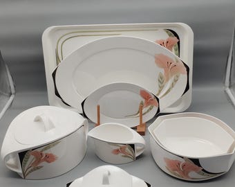 Complementary pieces from the Villeroy & Boch Iris series: soup tureen, serving platter, gravy boat, tray, butter dish.