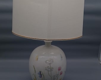 Fantastic table lamp by Kaestner Laxionia type 1618 with a flower meadow on the porcelain lamp base.