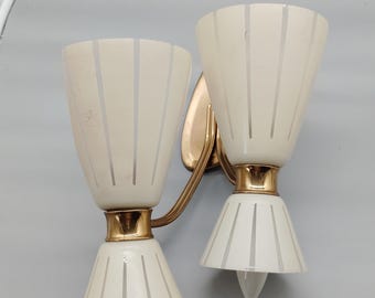 Replacement shades for the pictured mid-century wall lamp.