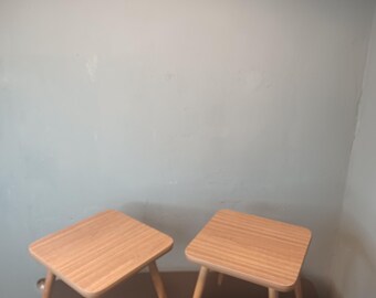 Beautiful pair of mid century flower stool side tables made of wood in brown.