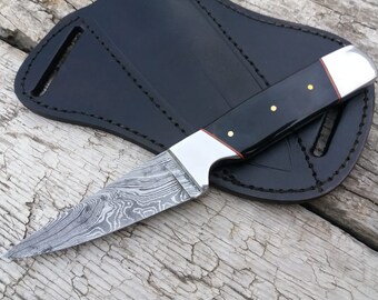 8.00 inches Damascus steel custom handmade hunting knife . 304 steel bolsters  and bull horn handle