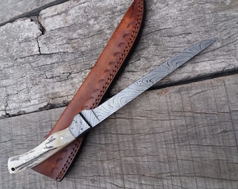 11  inches Damascus steel fishing fillet knife stag antler handle Damascus steel bolsters. Cowhide leather sheath. Strong