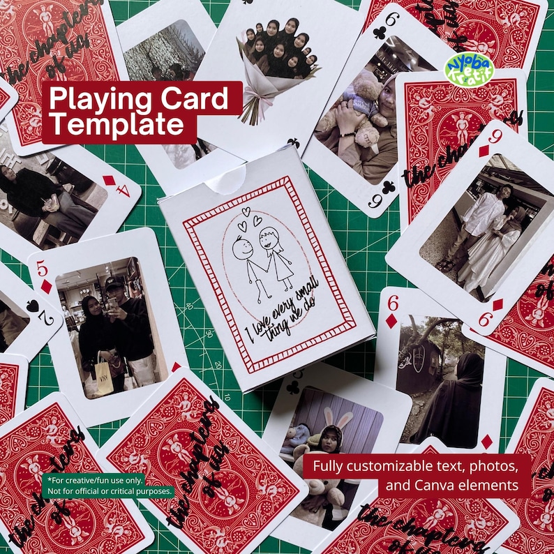 May include: A deck of playing cards with red backs and white faces, scattered around a white card box. The box features a red border and a drawing of two stick figures holding hands. The cards have photos.