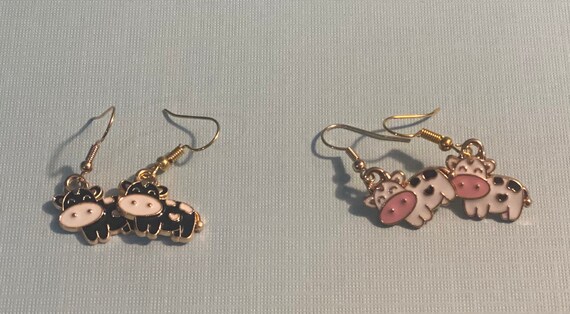 Black and white cow dangle earrings