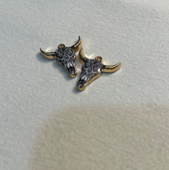 Black and white cows head earrings