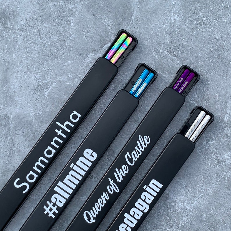 solid color options: rainbow, blue, purple and silver personalized engraved chopsticks with a personalized or blank black pull box case.
