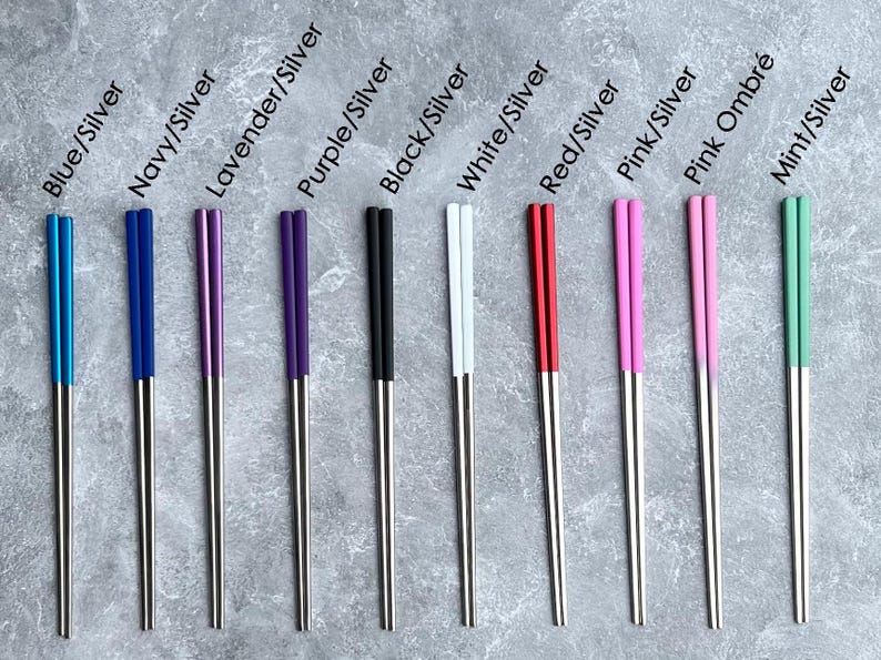 Color options for two tone silver tip personalized engraved chopsticks with a personalized or blank black pull box case.