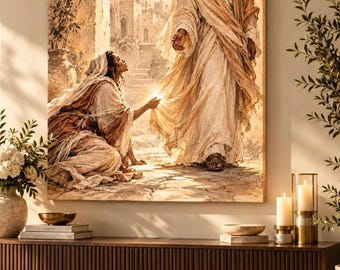 Peut inclure: Une impression d'art mural rectangulaire représentant une personne agenouillée tendant la main pour toucher l'ourlet de la robe d'une silhouette debout. L'œuvre présente des tons sépia chauds, une architecture en pierre ancienne et une lumière vive émanant du point de contact entre les deux personnages.