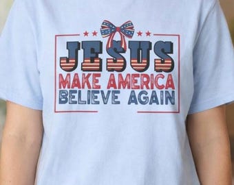 愛国的なクリスチャンコケットシャツ、イエスはアメリカに再び信仰を抱かせるTシャツ、信仰Tシャツ、7月4日の贈り物ユニセックスTシャツ、アメリカーナレガロ