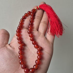 Natural red aqeeq tasbih , red agate tasbih , 33 beads agate tasbih , rosary beads , agate rosary , agate prayer beads , red carnelian agate prayer beads , natural yemeni aqeeq tasbih , Islamic agate tasbih , 33 beads tasbih , red agate tasbih , gifts for Muslim,  yemeni aqeeq tasbih , agate prayer beads , rosary beads , Muslim prayer beads , Islamic prayer beads , round aqeeq beads tasbih , agate beads tasbih , gifts for Muslim friends , Islamic gifts,  Islamic aqeeq tasbih ,rosary beads ,beads