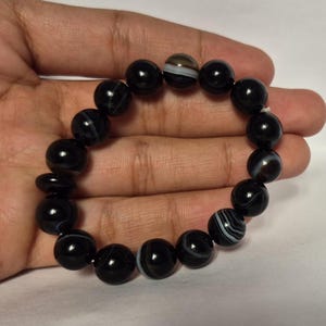 Black Agate beads, round aqeeq Bracelet ,suleimani aqeeq Bracelet , Bracelet , black agate , agate beads , round beads , Islamic necklace, natural aqeeq , Yemeni aqeeq , agate Bracelet , round aqeeq beads , aqeeq natural beads , natural stone , banded agate bracelet,  aqeeq beads bracelet,  round beaded bracelet,  beautiful gifts , best gifts for her , gifts for brother  , gifts for him , casual wear bracelet,  everyday wear bracelet,  aqeeq jewelry, yemeni aqeeq,  aqiq Bracelet, agate Bracelet,