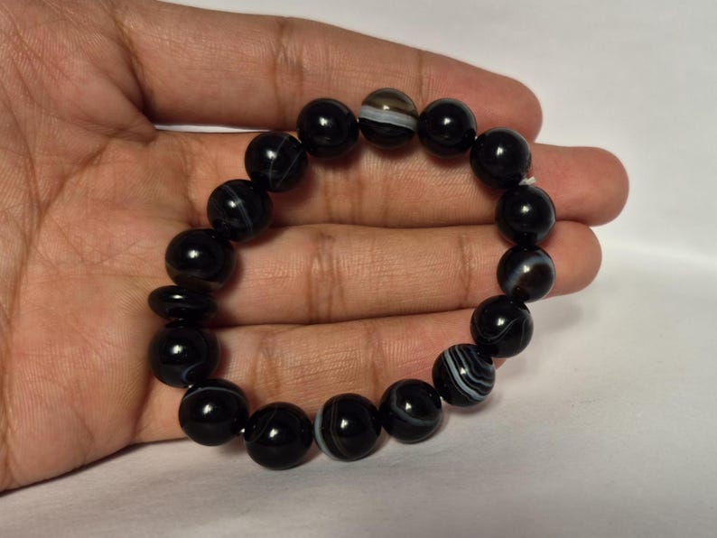 Black Agate beads, round aqeeq Bracelet ,suleimani aqeeq Bracelet , Bracelet , black agate , agate beads , round beads , Islamic necklace, natural aqeeq , Yemeni aqeeq , agate Bracelet , round aqeeq beads , aqeeq natural beads , natural stone , banded agate bracelet,  aqeeq beads bracelet,  round beaded bracelet,  beautiful gifts , best gifts for her , gifts for brother  , gifts for him , casual wear bracelet,  everyday wear bracelet,  aqeeq jewelry, yemeni aqeeq,  aqiq Bracelet, agate Bracelet,