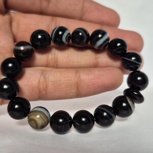 Black Agate beads, round aqeeq Bracelet ,suleimani aqeeq Bracelet , Bracelet , black agate , agate beads , round beads , Islamic necklace, natural aqeeq , Yemeni aqeeq , agate Bracelet , round aqeeq beads , aqeeq natural beads , natural stone , banded agate bracelet,  aqeeq beads bracelet,  round beaded bracelet,  beautiful gifts , best gifts for her , gifts for brother  , gifts for him , casual wear bracelet,  everyday wear bracelet,  aqeeq jewelry, yemeni aqeeq,  aqiq Bracelet, agate Bracelet,
