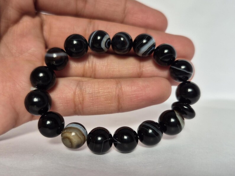 Black Agate beads, round aqeeq Bracelet ,suleimani aqeeq Bracelet , Bracelet , black agate , agate beads , round beads , Islamic necklace, natural aqeeq , Yemeni aqeeq , agate Bracelet , round aqeeq beads , aqeeq natural beads , natural stone , banded agate bracelet,  aqeeq beads bracelet,  round beaded bracelet,  beautiful gifts , best gifts for her , gifts for brother  , gifts for him , casual wear bracelet,  everyday wear bracelet,  aqeeq jewelry, yemeni aqeeq,  aqiq Bracelet, agate Bracelet,