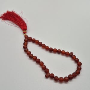 Natural red aqeeq tasbih , red agate tasbih , 33 beads agate tasbih , rosary beads , agate rosary , agate prayer beads , red carnelian agate prayer beads , natural yemeni aqeeq tasbih , Islamic agate tasbih , 33 beads tasbih , red agate tasbih , gifts for Muslim,  yemeni aqeeq tasbih , agate prayer beads , rosary beads , Muslim prayer beads , Islamic prayer beads , round aqeeq beads tasbih , agate beads tasbih , gifts for Muslim friends , Islamic gifts,  Islamic aqeeq tasbih ,rosary beads ,beads