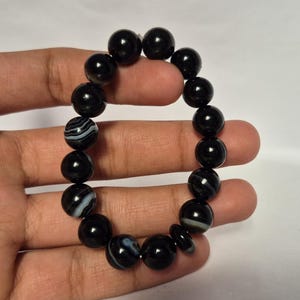 Black Agate beads, round aqeeq Bracelet ,suleimani aqeeq Bracelet , Bracelet , black agate , agate beads , round beads , Islamic necklace, natural aqeeq , Yemeni aqeeq , agate Bracelet , round aqeeq beads , aqeeq natural beads , natural stone , banded agate bracelet,  aqeeq beads bracelet,  round beaded bracelet,  beautiful gifts , best gifts for her , gifts for brother  , gifts for him , casual wear bracelet,  everyday wear bracelet,  aqeeq jewelry, yemeni aqeeq,  aqiq Bracelet, agate Bracelet,