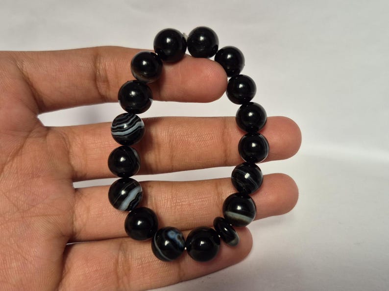 Black Agate beads, round aqeeq Bracelet ,suleimani aqeeq Bracelet , Bracelet , black agate , agate beads , round beads , Islamic necklace, natural aqeeq , Yemeni aqeeq , agate Bracelet , round aqeeq beads , aqeeq natural beads , natural stone , banded agate bracelet,  aqeeq beads bracelet,  round beaded bracelet,  beautiful gifts , best gifts for her , gifts for brother  , gifts for him , casual wear bracelet,  everyday wear bracelet,  aqeeq jewelry, yemeni aqeeq,  aqiq Bracelet, agate Bracelet,