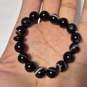 Black Agate beads, round aqeeq Bracelet ,suleimani aqeeq Bracelet , Bracelet , black agate , agate beads , round beads , Islamic necklace, natural aqeeq , Yemeni aqeeq , agate Bracelet , round aqeeq beads , aqeeq natural beads , natural stone , banded agate bracelet,  aqeeq beads bracelet,  round beaded bracelet,  beautiful gifts , best gifts for her , gifts for brother  , gifts for him , casual wear bracelet,  everyday wear bracelet,  aqeeq jewelry, yemeni aqeeq,  aqiq Bracelet, agate Bracelet,