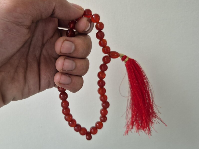Natural red aqeeq tasbih , red agate tasbih , 33 beads agate tasbih , rosary beads , agate rosary , agate prayer beads , red carnelian agate prayer beads , natural yemeni aqeeq tasbih , Islamic agate tasbih , 33 beads tasbih , red agate tasbih , gifts for Muslim,  yemeni aqeeq tasbih , agate prayer beads , rosary beads , Muslim prayer beads , Islamic prayer beads , round aqeeq beads tasbih , agate beads tasbih , gifts for Muslim friends , Islamic gifts,  Islamic aqeeq tasbih ,rosary beads ,beads