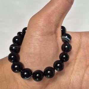 Black Agate beads, round aqeeq Bracelet ,suleimani aqeeq Bracelet , Bracelet , black agate , agate beads , round beads , Islamic necklace, natural aqeeq , Yemeni aqeeq , agate Bracelet , round aqeeq beads , aqeeq natural beads , natural stone , banded agate bracelet,  aqeeq beads bracelet,  round beaded bracelet,  beautiful gifts , best gifts for her , gifts for brother  , gifts for him , casual wear bracelet,  everyday wear bracelet,  aqeeq jewelry, yemeni aqeeq,  aqiq Bracelet, agate Bracelet,