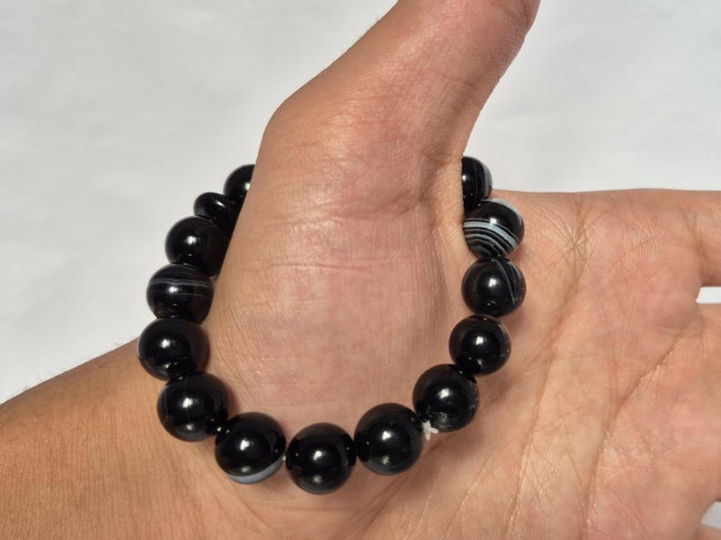 Black Agate beads, round aqeeq Bracelet ,suleimani aqeeq Bracelet , Bracelet , black agate , agate beads , round beads , Islamic necklace, natural aqeeq , Yemeni aqeeq , agate Bracelet , round aqeeq beads , aqeeq natural beads , natural stone , banded agate bracelet,  aqeeq beads bracelet,  round beaded bracelet,  beautiful gifts , best gifts for her , gifts for brother  , gifts for him , casual wear bracelet,  everyday wear bracelet,  aqeeq jewelry, yemeni aqeeq,  aqiq Bracelet, agate Bracelet,