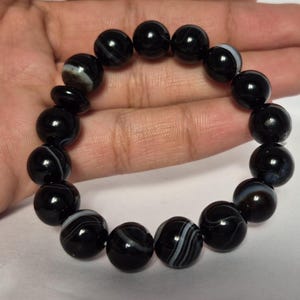 Black Agate beads, round aqeeq Bracelet ,suleimani aqeeq Bracelet , Bracelet , black agate , agate beads , round beads , Islamic necklace, natural aqeeq , Yemeni aqeeq , agate Bracelet , round aqeeq beads , aqeeq natural beads , natural stone , banded agate bracelet,  aqeeq beads bracelet,  round beaded bracelet,  beautiful gifts , best gifts for her , gifts for brother  , gifts for him , casual wear bracelet,  everyday wear bracelet,  aqeeq jewelry, yemeni aqeeq,  aqiq Bracelet, agate Bracelet,