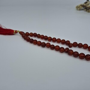 Natural red aqeeq tasbih , red agate tasbih , 33 beads agate tasbih , rosary beads , agate rosary , agate prayer beads , red carnelian agate prayer beads , natural yemeni aqeeq tasbih , Islamic agate tasbih , 33 beads tasbih , red agate tasbih , gifts for Muslim,  yemeni aqeeq tasbih , agate prayer beads , rosary beads , Muslim prayer beads , Islamic prayer beads , round aqeeq beads tasbih , agate beads tasbih , gifts for Muslim friends , Islamic gifts,  Islamic aqeeq tasbih ,rosary beads ,beads