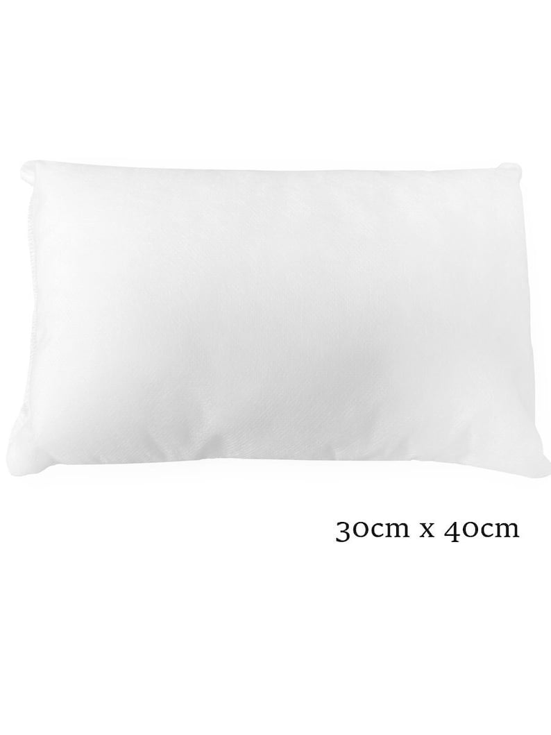 May include: A white rectangular pillow measuring 30 inches by 40 inches.