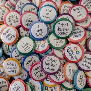 Bulk neurodiversity and disability awareness pin badges. 31mm (1.25 inch) diameter. Autism awareness, disability pride, hidden disability.