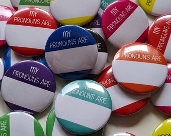 Bulk pack blank pronoun pins. 1.25 inches (32mm) diameter. Customisable. My pronouns are. Multiple colours.