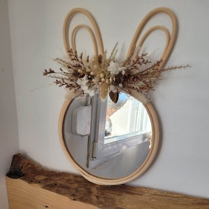 Rabbit-shaped rattan mirror with dried flowers